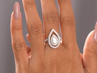 Pear Cut Moissanite Engagement Ring: Double Halo with Split Shank Pavé Diamonds